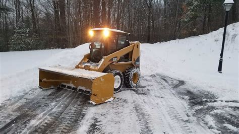 cat skid steer plowing snow|cat snow removal machine.